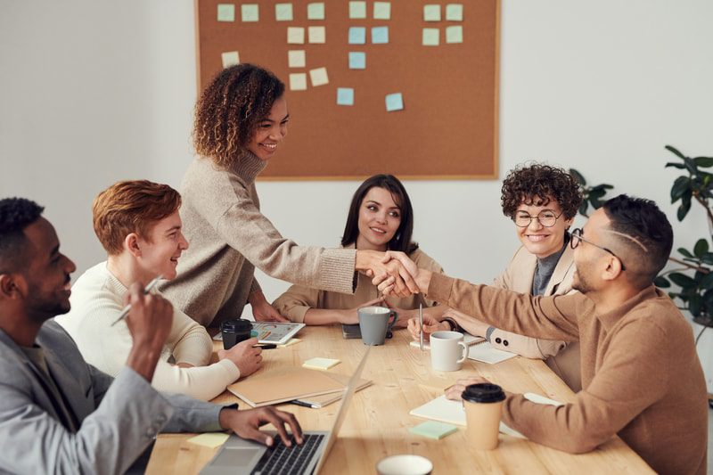 Group of multicultural employees at the table